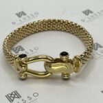 Brazalete de oro con onix