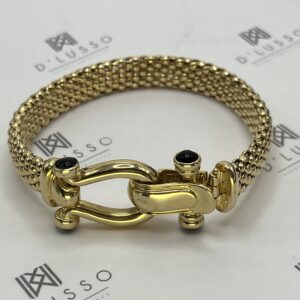 Brazalete de oro con onix